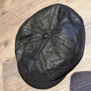 Burberry vintage Black Leather cap with signature lining and brown stitching